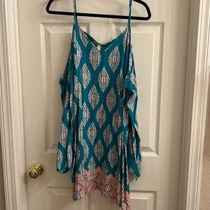 Really flattering turquoise dress with cut out arms. Size Xl